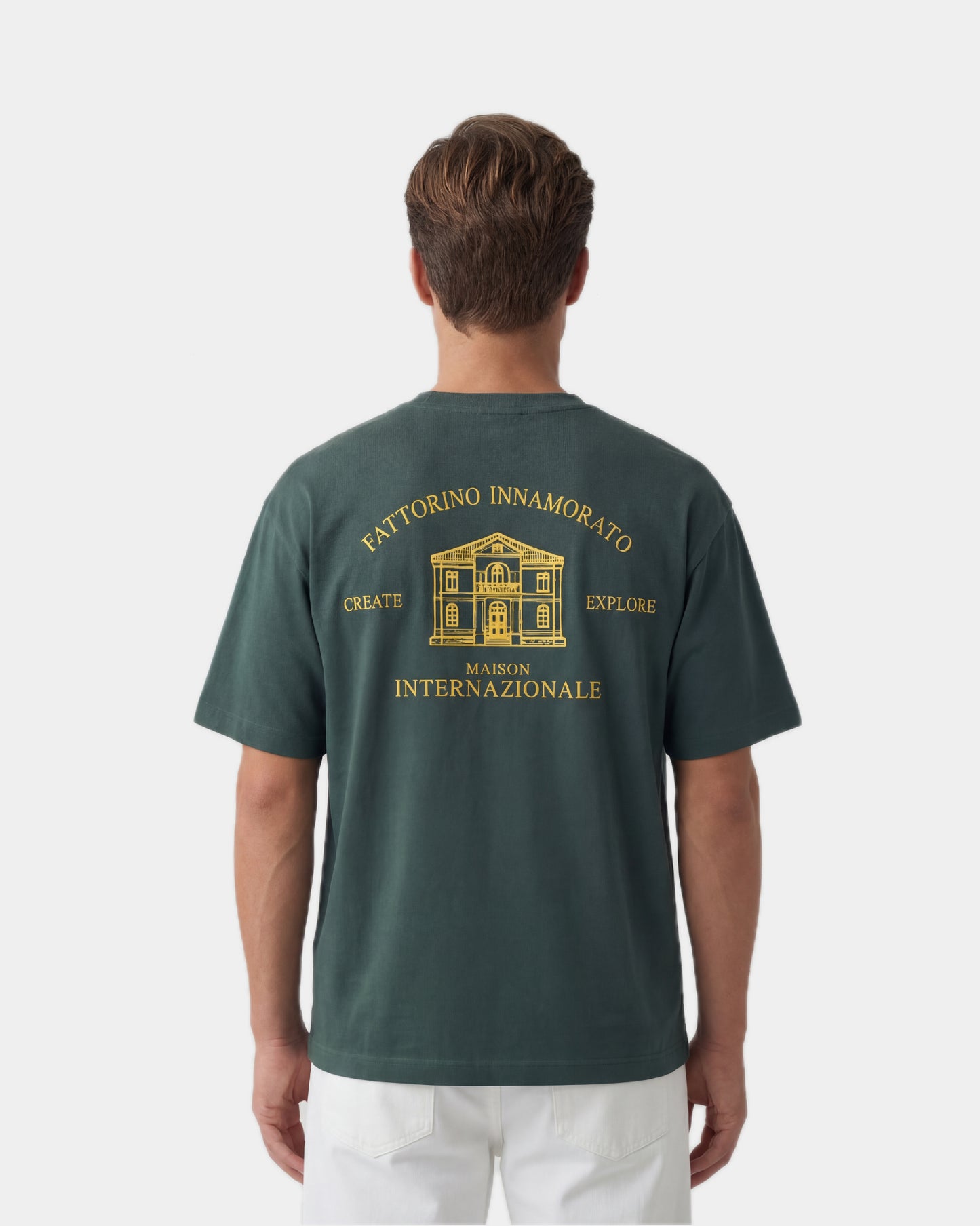 Green t-shirt with a graphic and text on the back against a white background. Fattorino Innamorato maison green