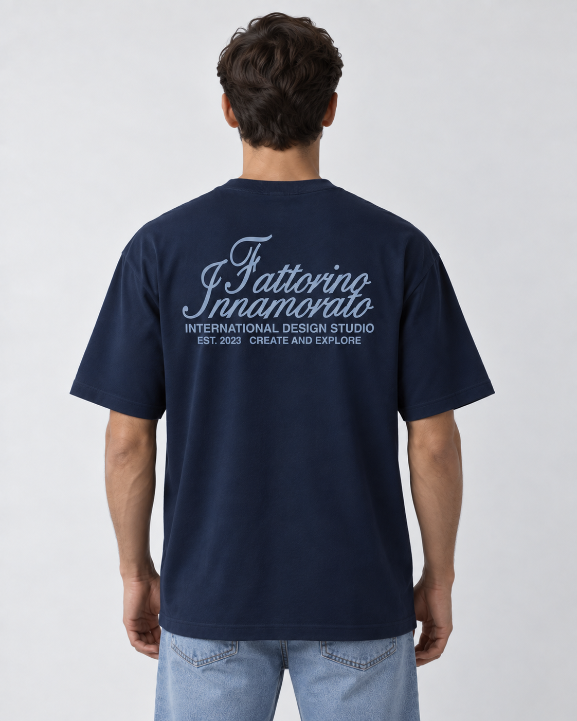 Navy blue t-shirt with blue text on a light gray background. Fattorino innamorato navy international