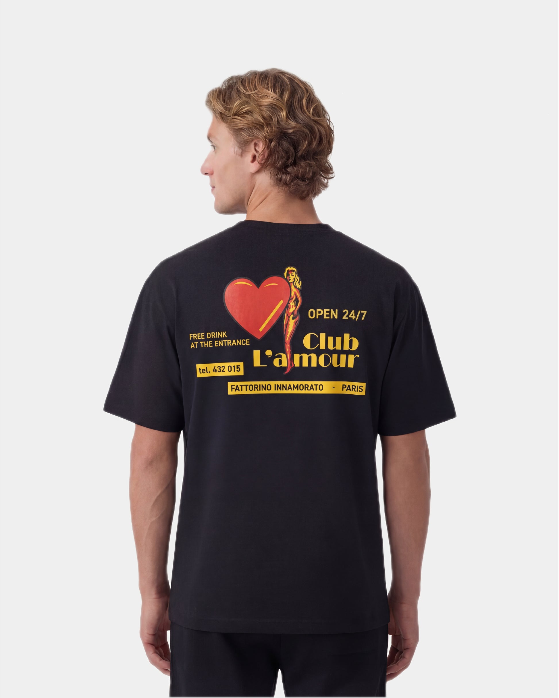 Black t-shirt with colorful graphic design on the back against a white background. Fattorino Innamorato club l'amour 