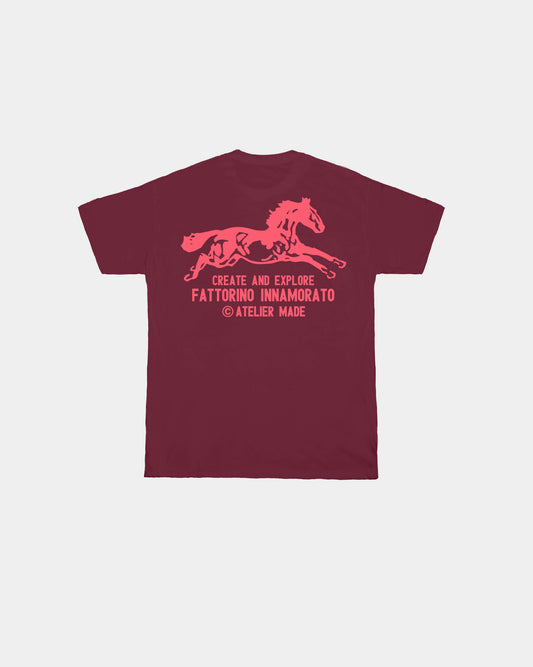 Burgundy red t-shirt with a horse graphic and text on the back against a white background. Fattorino Innamorato cavallo burgundy red 