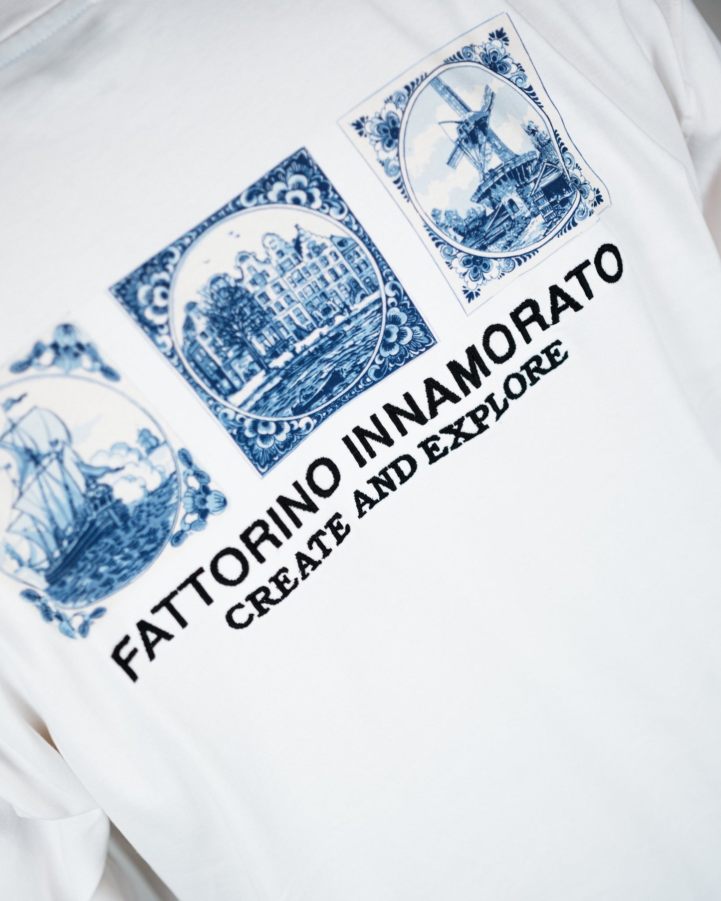 White longsleeve with blue graphics and text on a white background