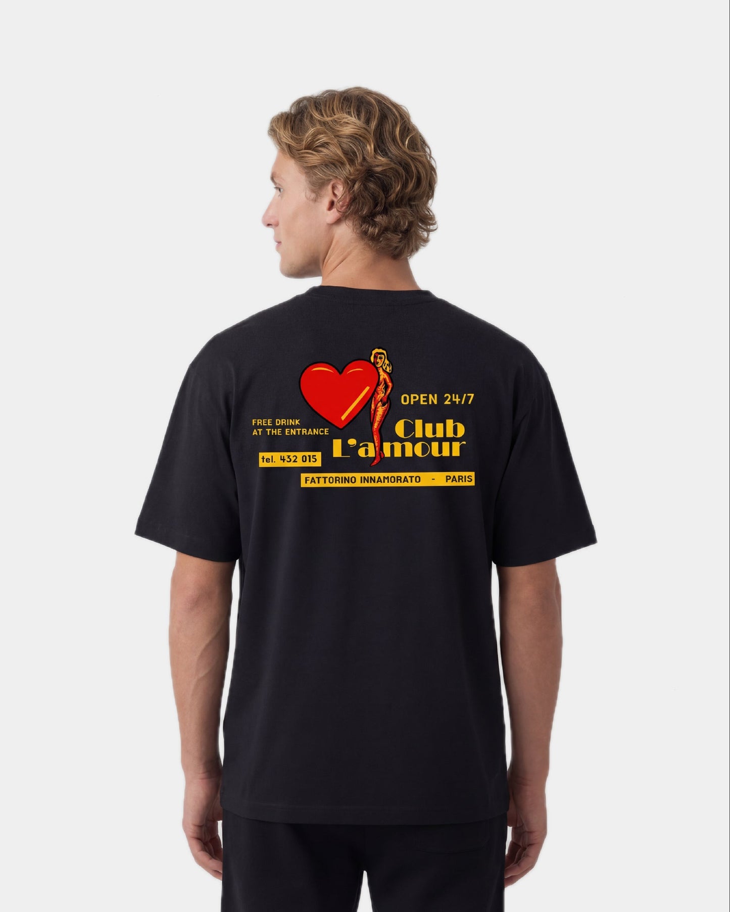 Black t-shirt with colorful graphic design on the back against a white background. Fattorino Innamorato club l'amour 