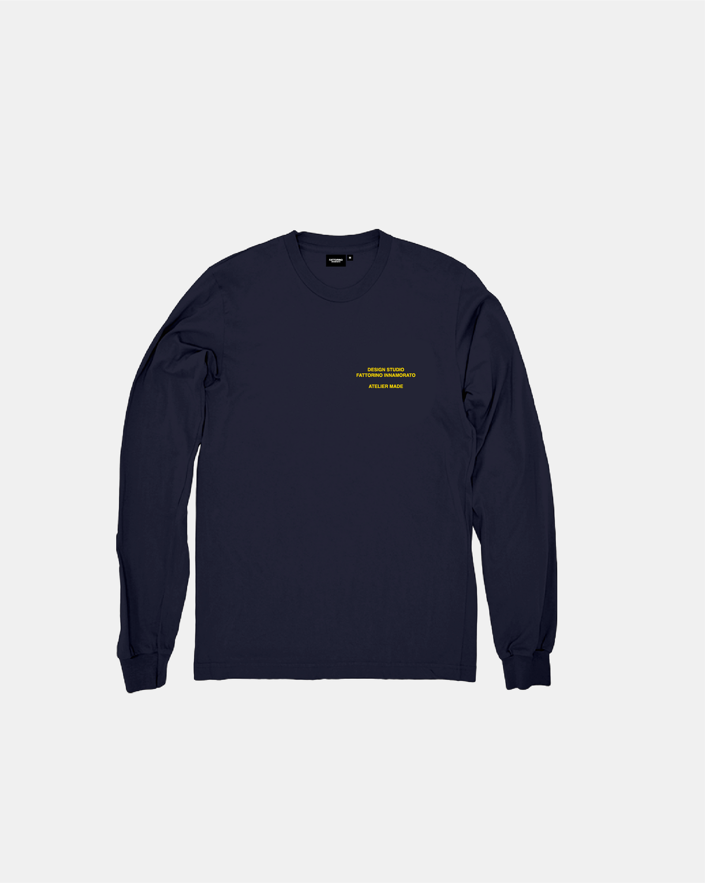 Navy long-sleeve shirt with yellow text and logo on a light gray background. Fattorino Innamorato maison 