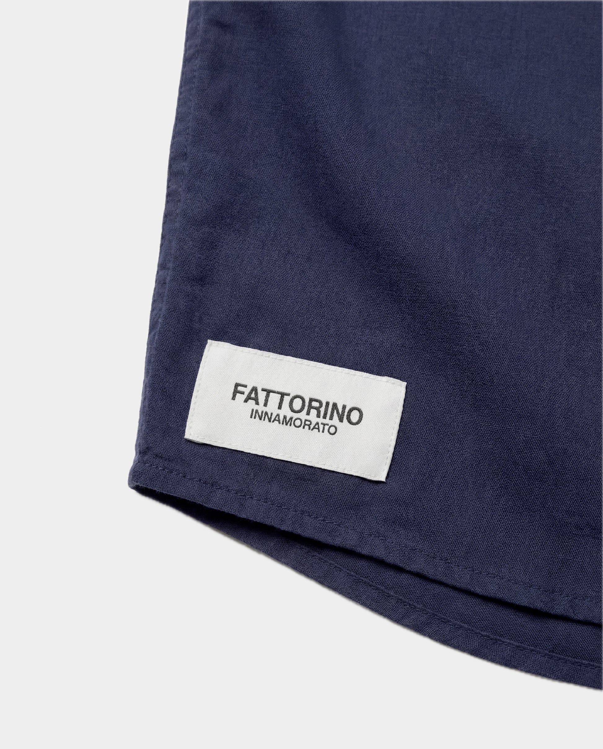 Navy blue button-up shirt on a light gray background. Fattorino Innamorato navy oxford blouse shirt 