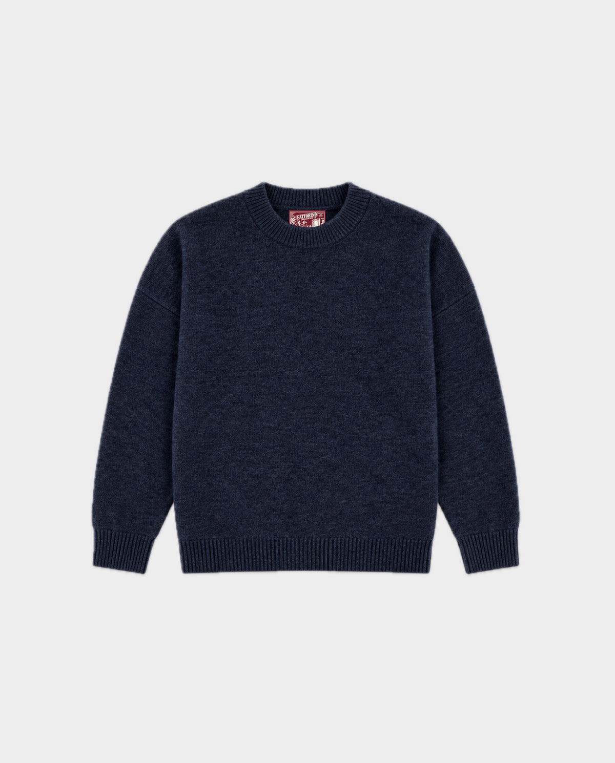 A dark navy blue knit crewneck sweater with ribbed cuffs and hem, displayed flat against a light gray background. Fattorino Innamorato navy sweater