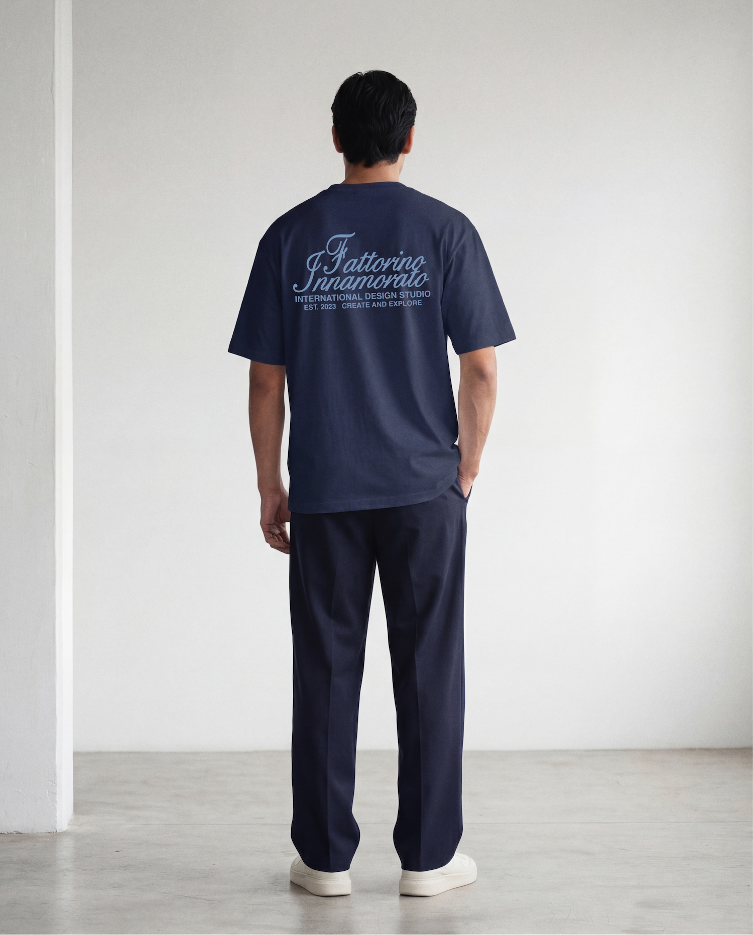 Navy blue t-shirt with blue text on a light gray background. Fattorino innamorato navy international